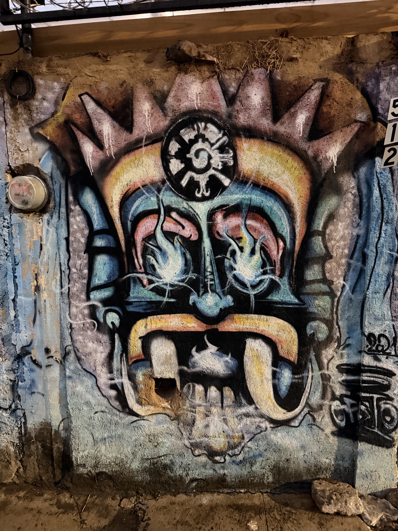 Painted eye mural photographed in Oaxaca